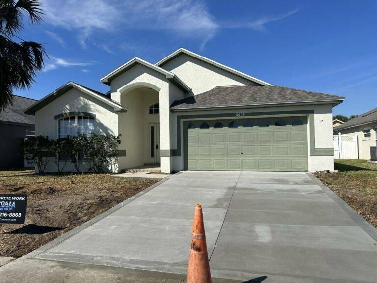 concrete driveway in spring hill, florida, in front of house